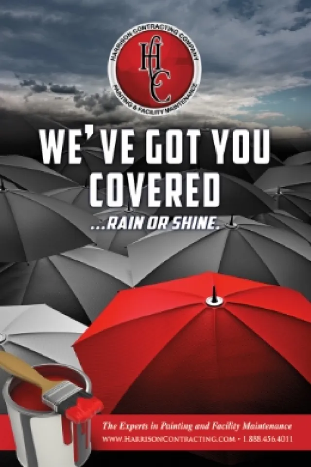Red umbrella among gray umbrellas with painting brush and paint can, highlighting coverage in any weather.