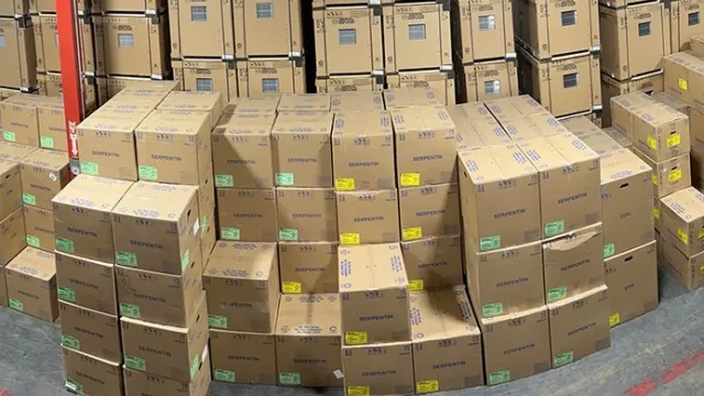 A panoramic view of a warehouse filled with neatly stacked cardboard boxes.
