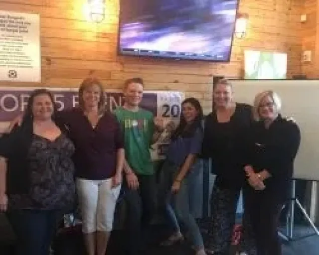 a group of people standing in a room