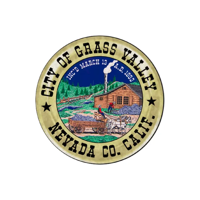 a circular logo with a building and trees in the background