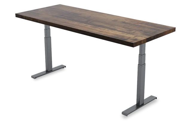 Adjustable standing desk with a dark wood tabletop and metal legs for ergonomic workspace setup.