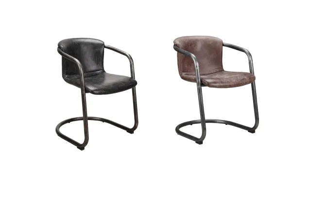 Set of two vintage industrial-style leather chairs with metal frames, one black and one brown, isolated on white.