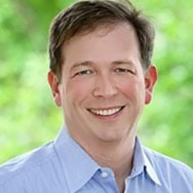 a man smiling for the camera