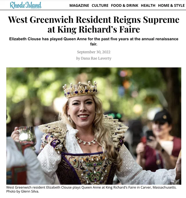 Woman dressed as Queen Anne with crown and ornate costume at King Richard's Faire renaissance event.