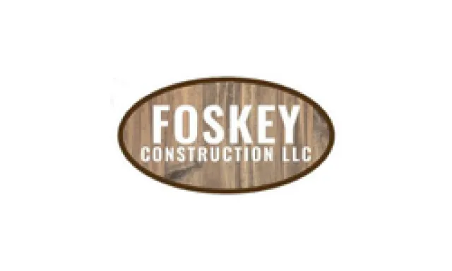 Foskey Construction LLC logo with white text on a wood grain oval background.