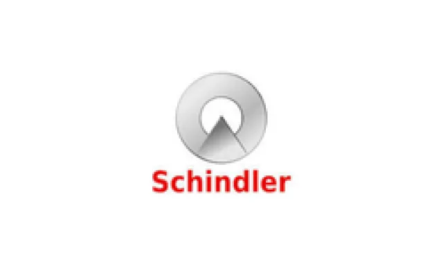 Schindler company logo featuring a silver circular emblem with a triangular shape and red text on white background