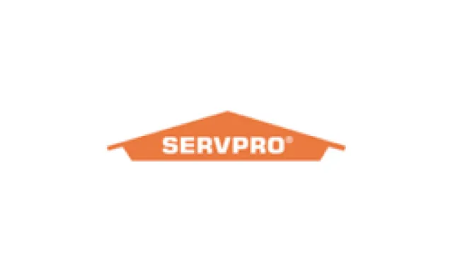 SERVPRO logo with bold white text inside an orange house-shaped emblem on a white background