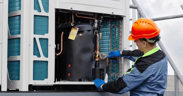 a person wearing a hard hat and safety gear