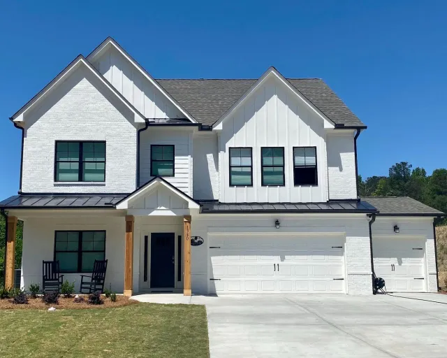 a white house with a garage