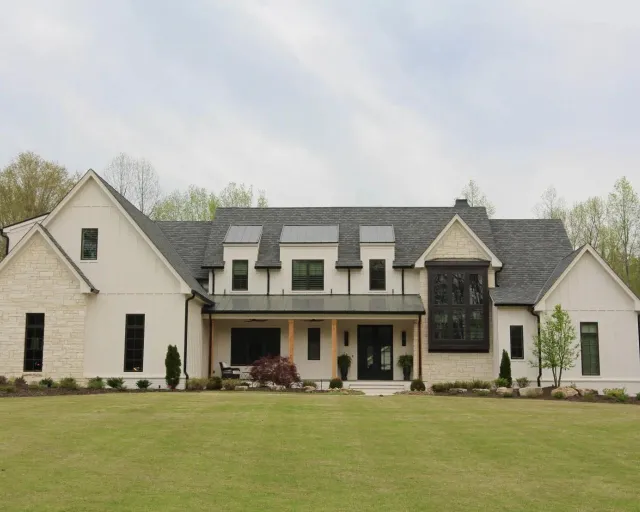 a large house with a lawn in front of it
