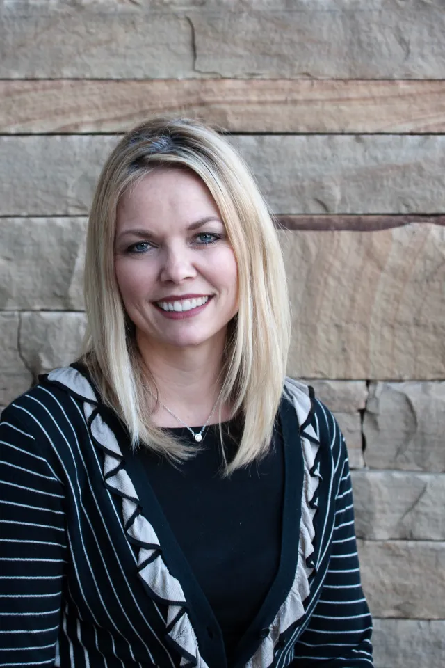a woman smiling for the camera