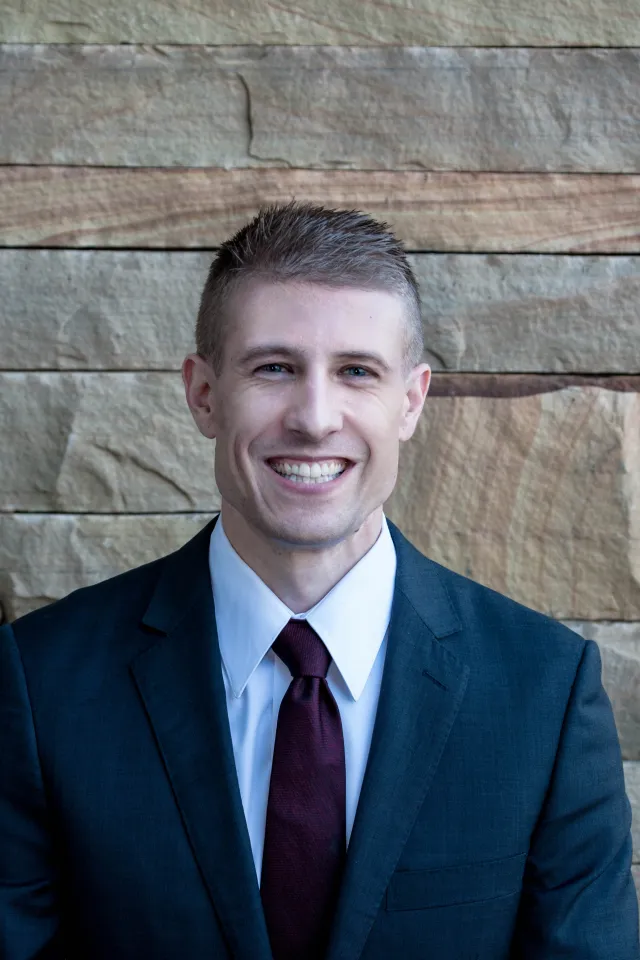 a man in a suit and tie