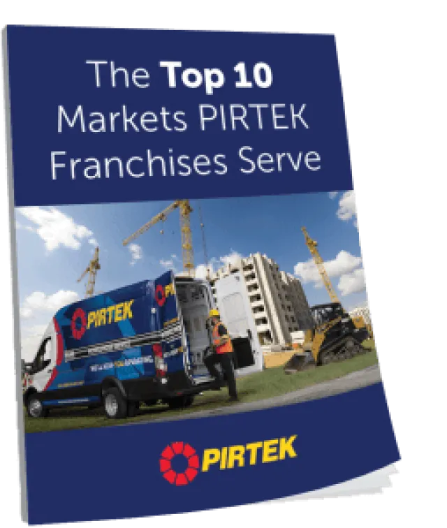 Brochure cover showing PIRTEK service van and worker at a construction site with cranes and buildings.