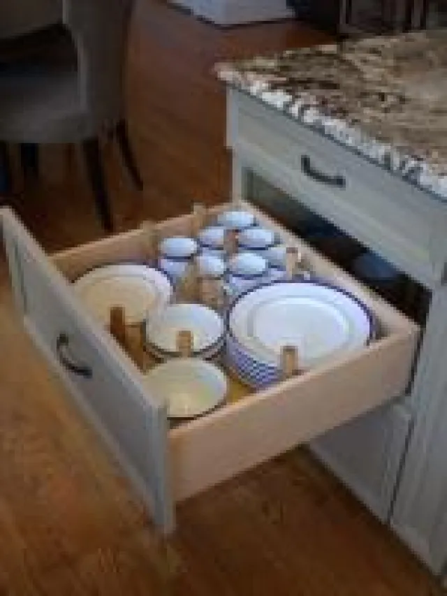 a white tub sitting next to a sink