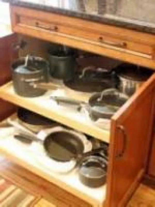 a stove top oven sitting inside of a kitchen
