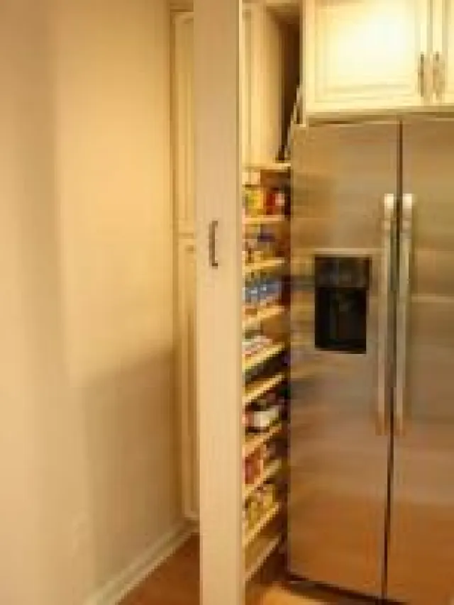 a stainless steel refrigerator in a room