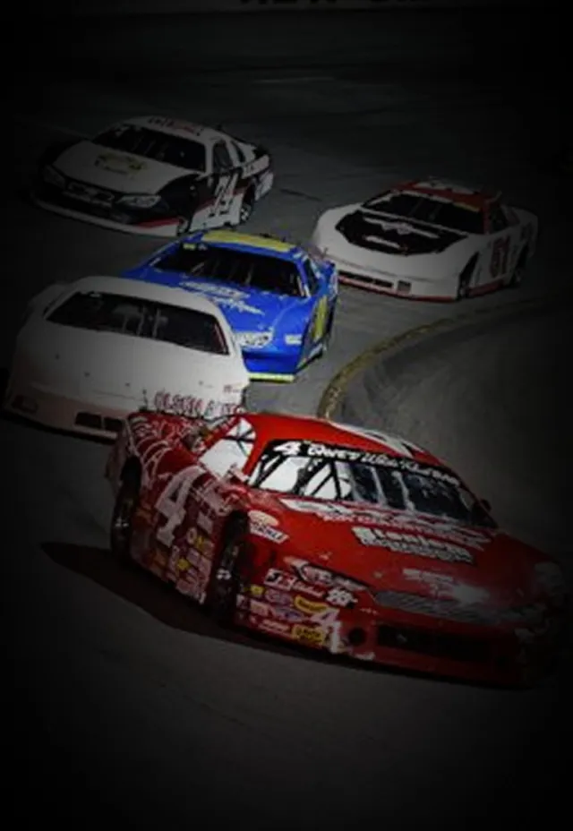 racecars racing down a track