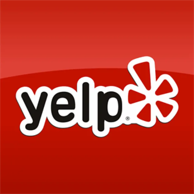 Yelp logo with bold black text and red flower icon on a vibrant red background.