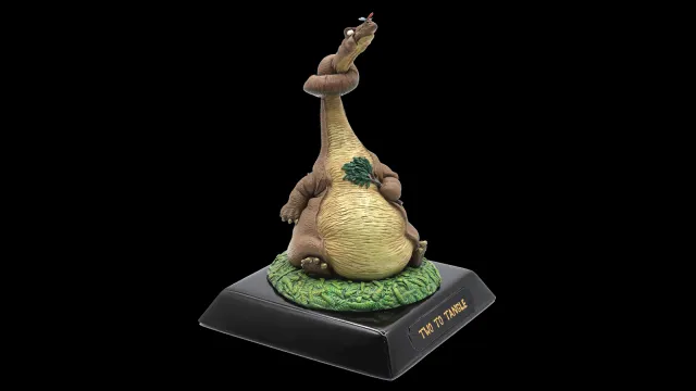 a small statue of a dinosaur