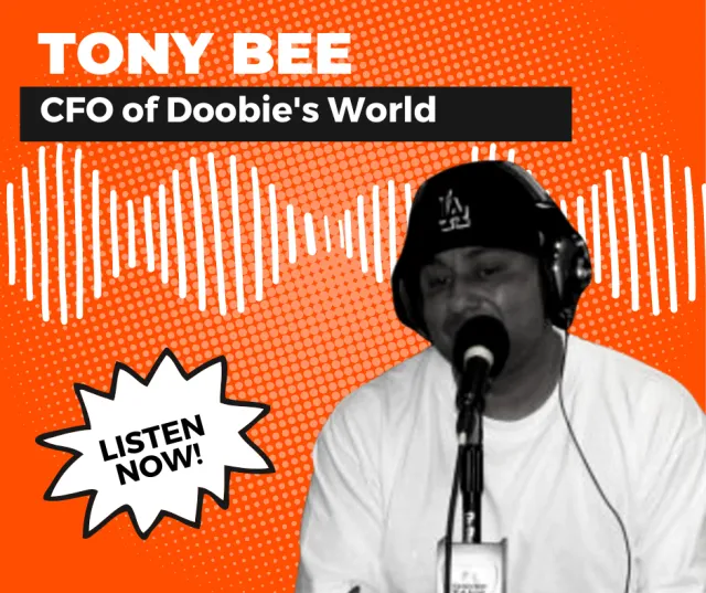a person wearing a white shirt and black hat with a microphone