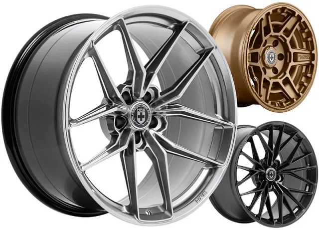 Three alloy car wheels in silver, bronze, and black finishes with intricate spoke designs on a white background
