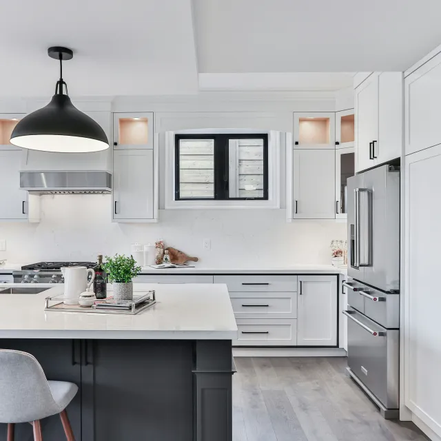 a kitchen with white cabinets