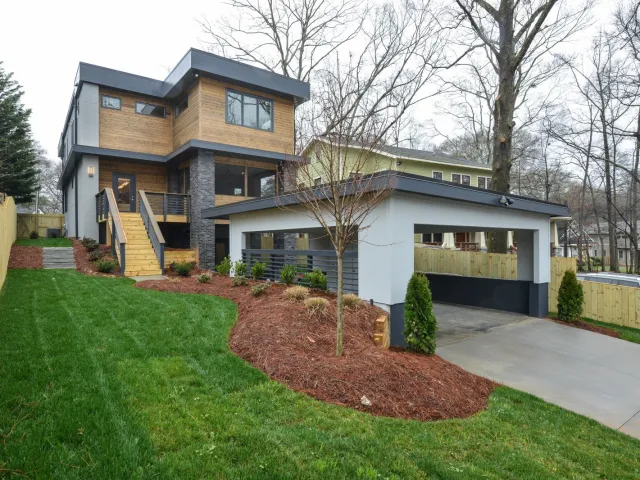 a house with a yard and a fence