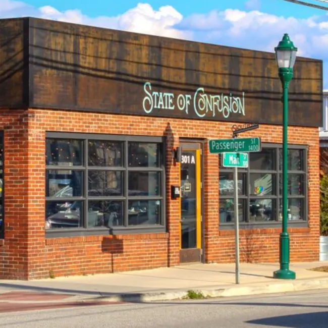 a brick building with a sign on it