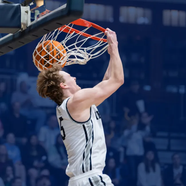 a man shooting a basketball