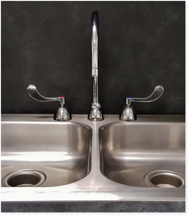 a sink with faucets and faucets