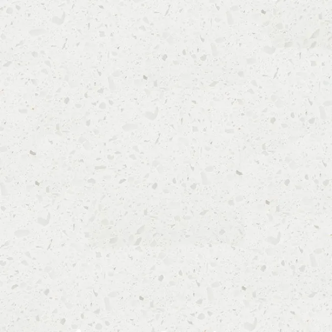 a white surface with small specks