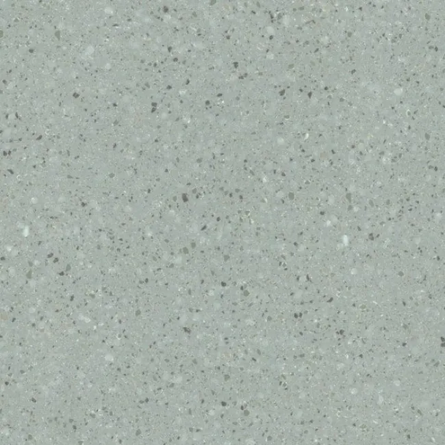a white surface with small specks