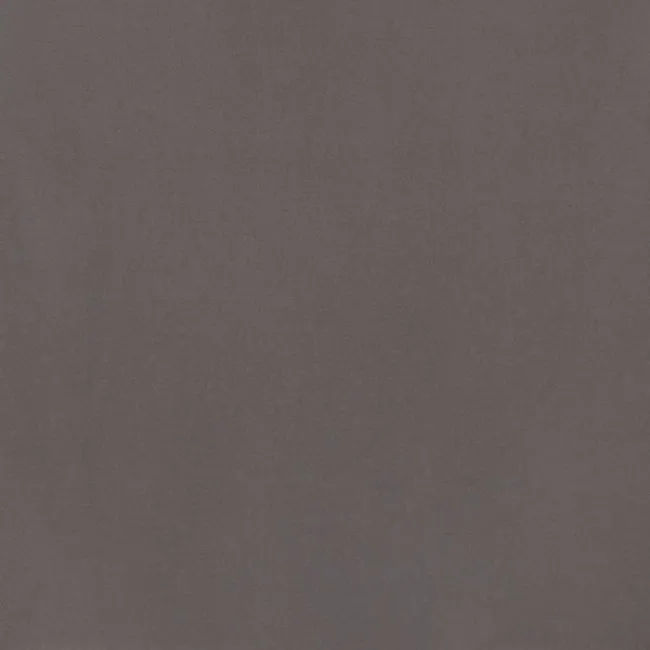 a grey surface with a dark background