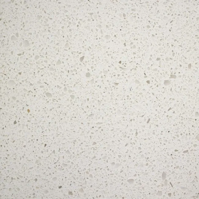 a white surface with small specks