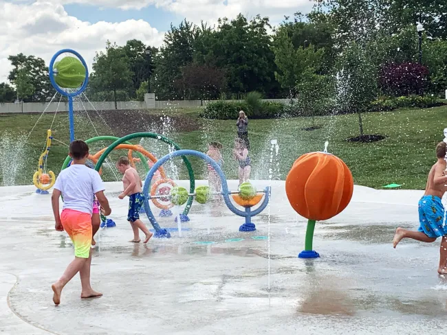 a group of people playing in a water park