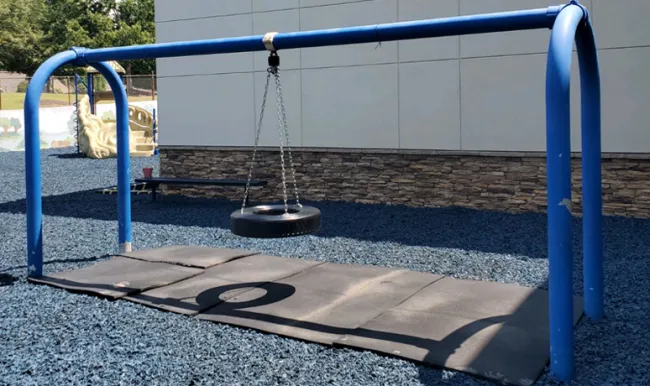 a swing set on a trampoline