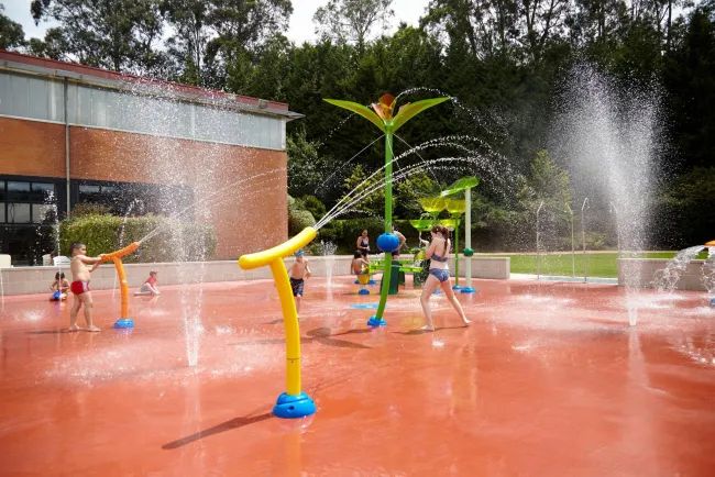 children playing in a water park