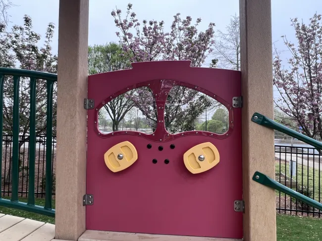 a red and green playground slide