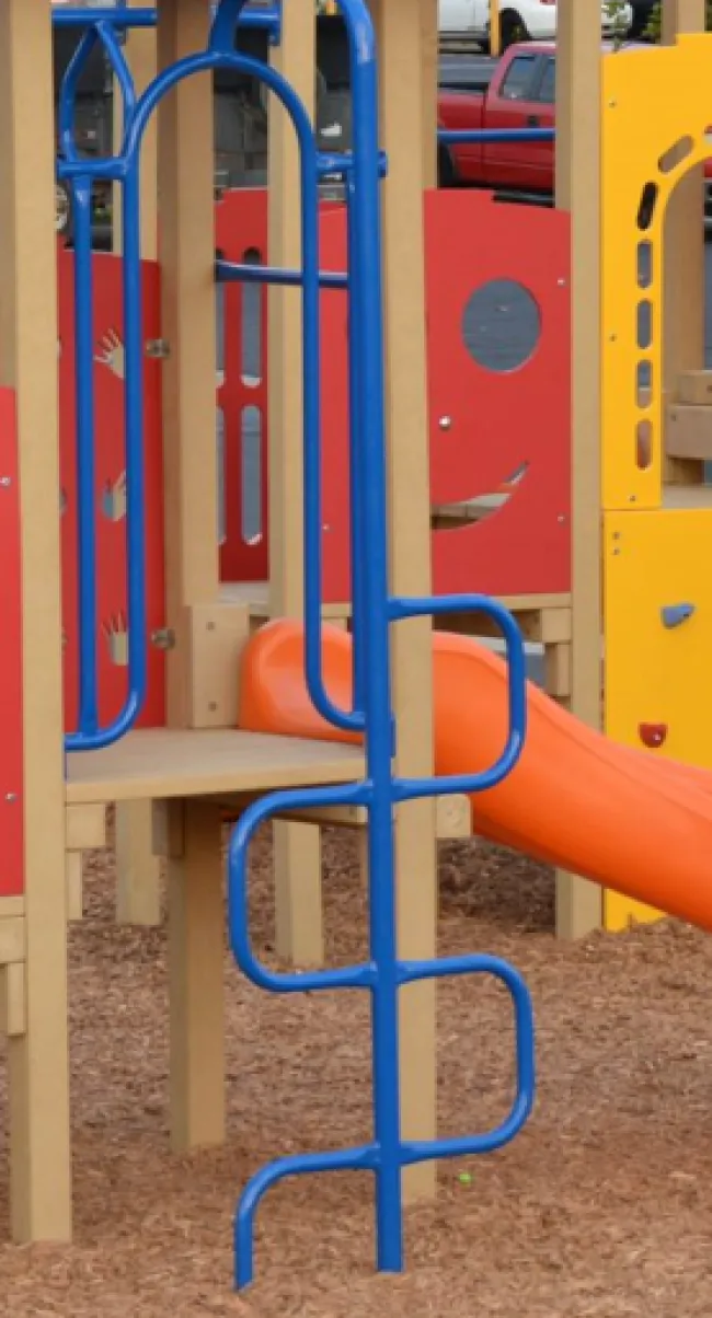 a playground with blue and yellow slide