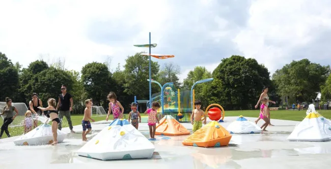 a group of people playing in a water park