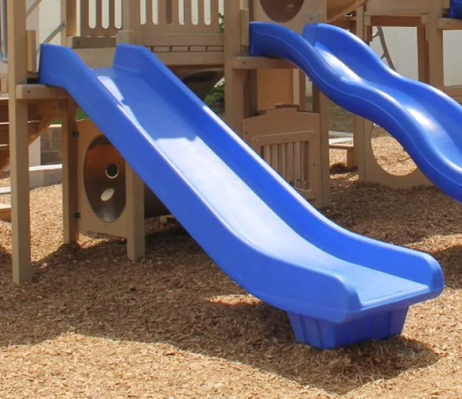 a blue slide on a playground