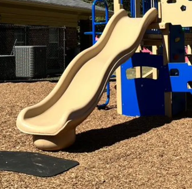 a blue and yellow playground toy