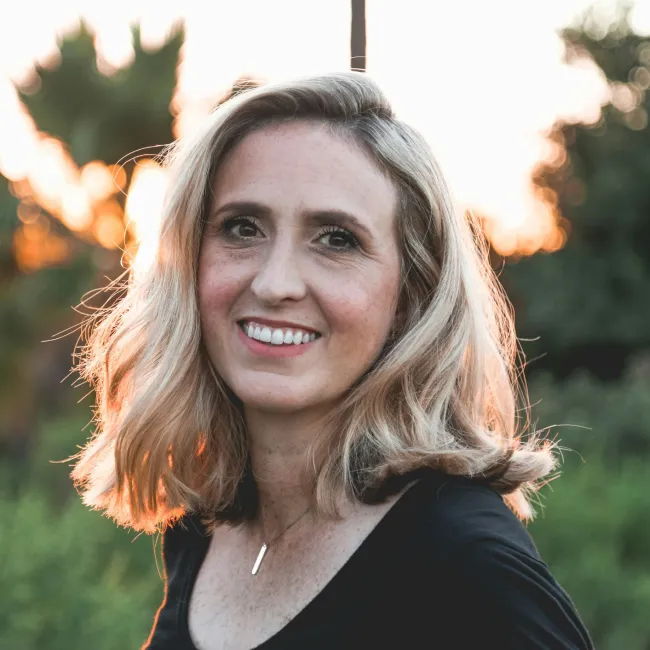 a woman smiling outside