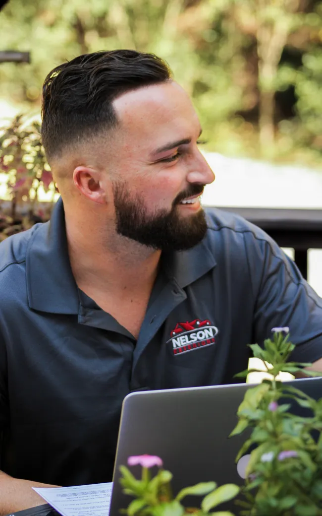 a man looking at a laptop