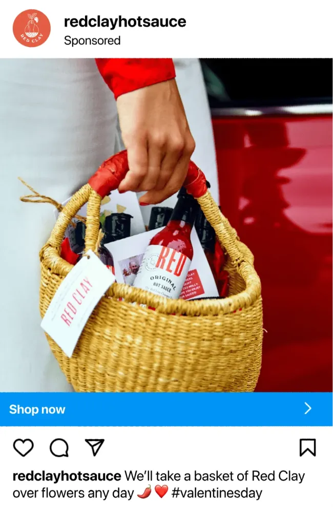 a hand holding a basket of gift bags
