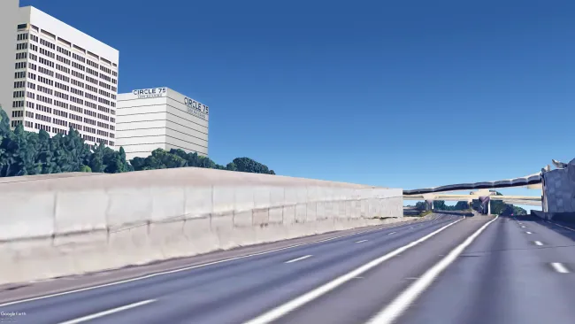 a highway with buildings on the side