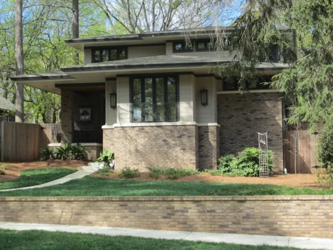 a house with a fence and trees