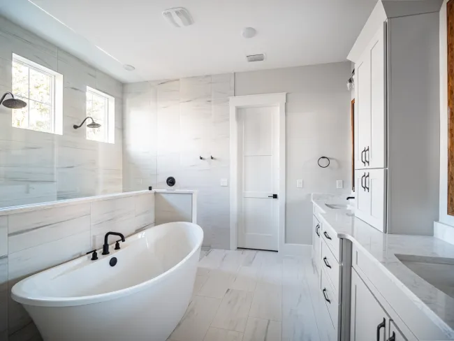 a bathroom with a tub and sink