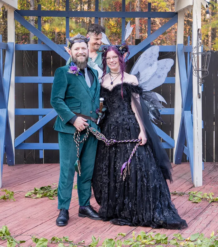 A couple joined by a handfasting cord during their ceremony