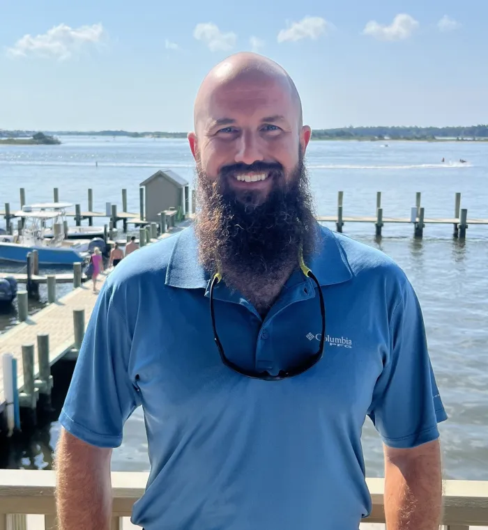 Michael Diehl standing next to a dock